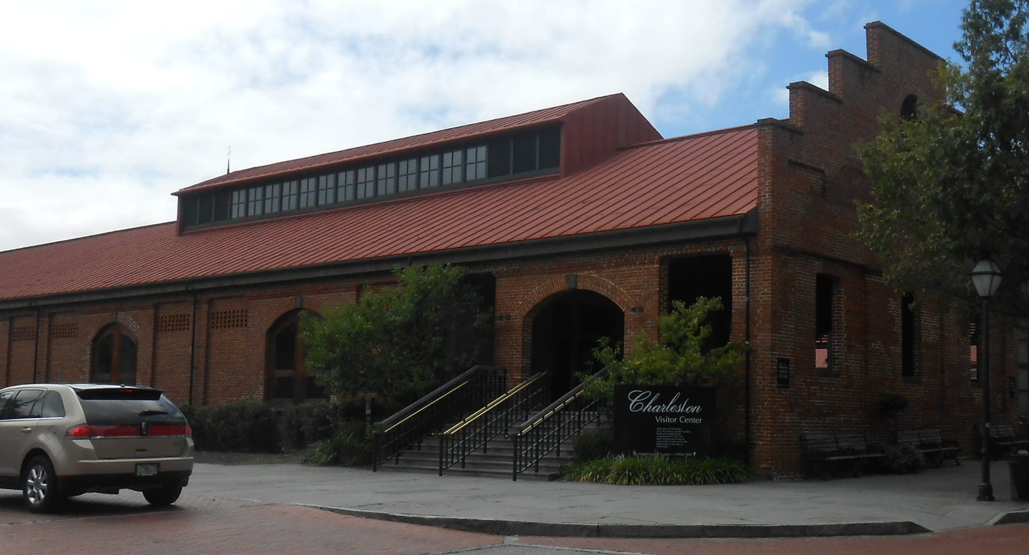 The Charleston Visitor Center, in a 19th-century railroad warehouse at 375 Meeting St. in downtown Charleston, in September 2013. Explore Charleston's visit-planning staff work at the center.