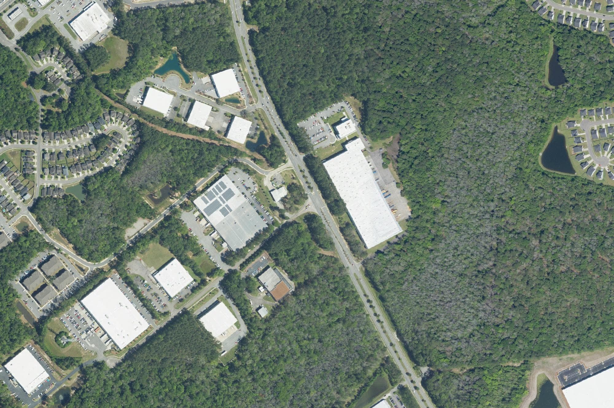 Aerial imagery taken April 18, 2023, shows business buildings along Carolina Commerce Parkway, which branches off Palmetto Commerce Parkway in North Charleston. IEB Americas' new facility is at 4100 Carolina Commerce Parkway.