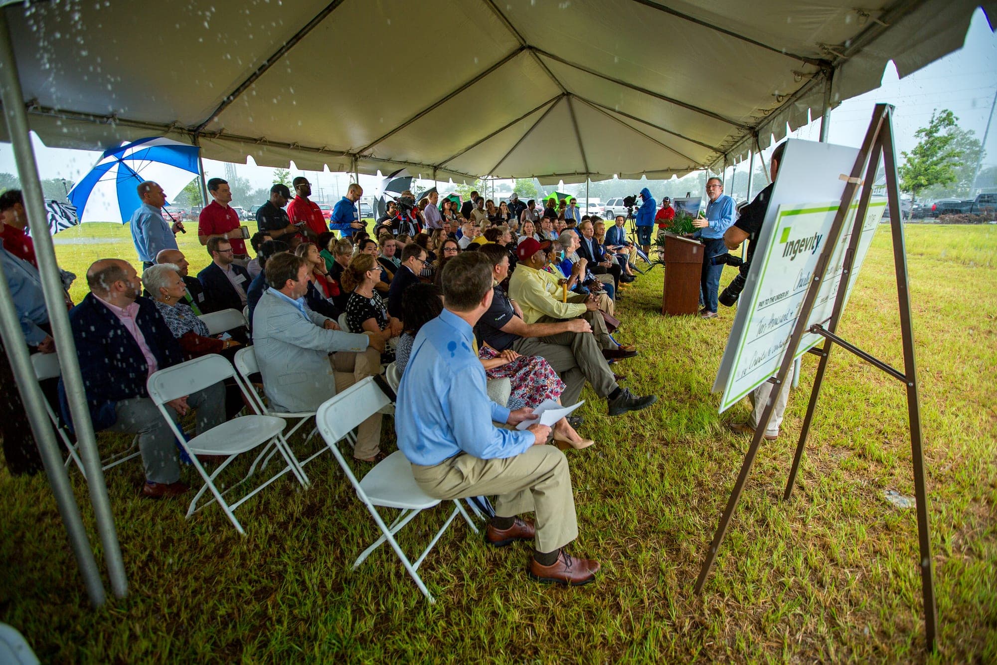 Guests sit under a tent at a July 31, 2018, groundbreaking for Ingevity's new global headquarters in North Charleston.
