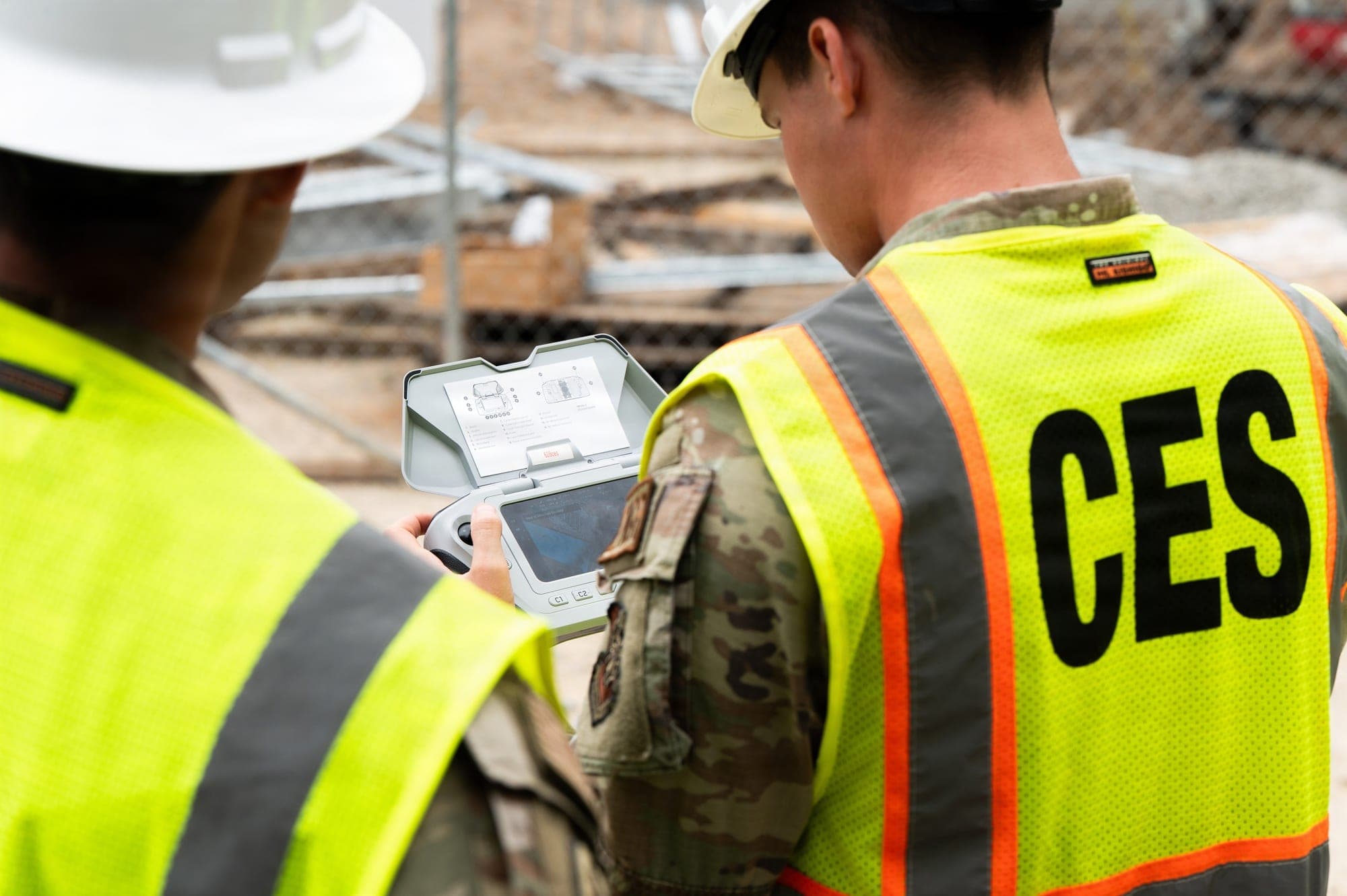 Two 628th Civil Engineer Squadron engineering assistants fly a drone to inspect a construction site at the base now called Joint Base Lindsey Graham on June 16, 2026.