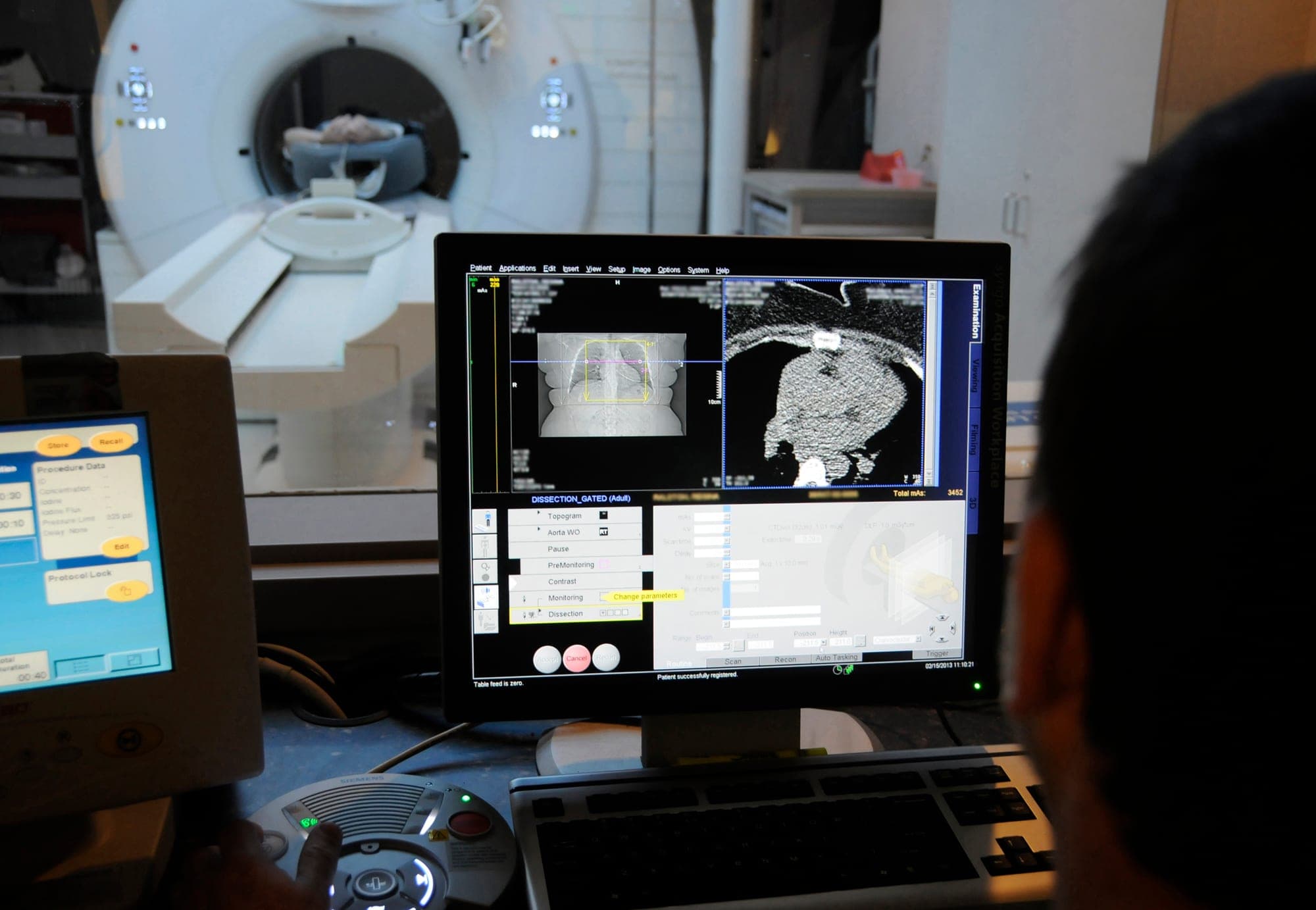 A computed tomography technologist reviews scan images at a CT scanner's control console at Naval Medical Center Portsmouth in Virginia in February 2013. This is a generic file photo; the Navy hospital is not part of the MUSC program.