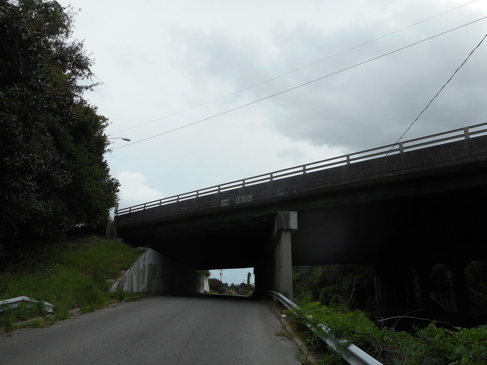 Hock Avenue passes under the U.S. 52-78 bridge, posted with a 13-foot clearance, beside the CSX rail line in North Charleston in September 2015. The crossing study includes Hock Avenue.