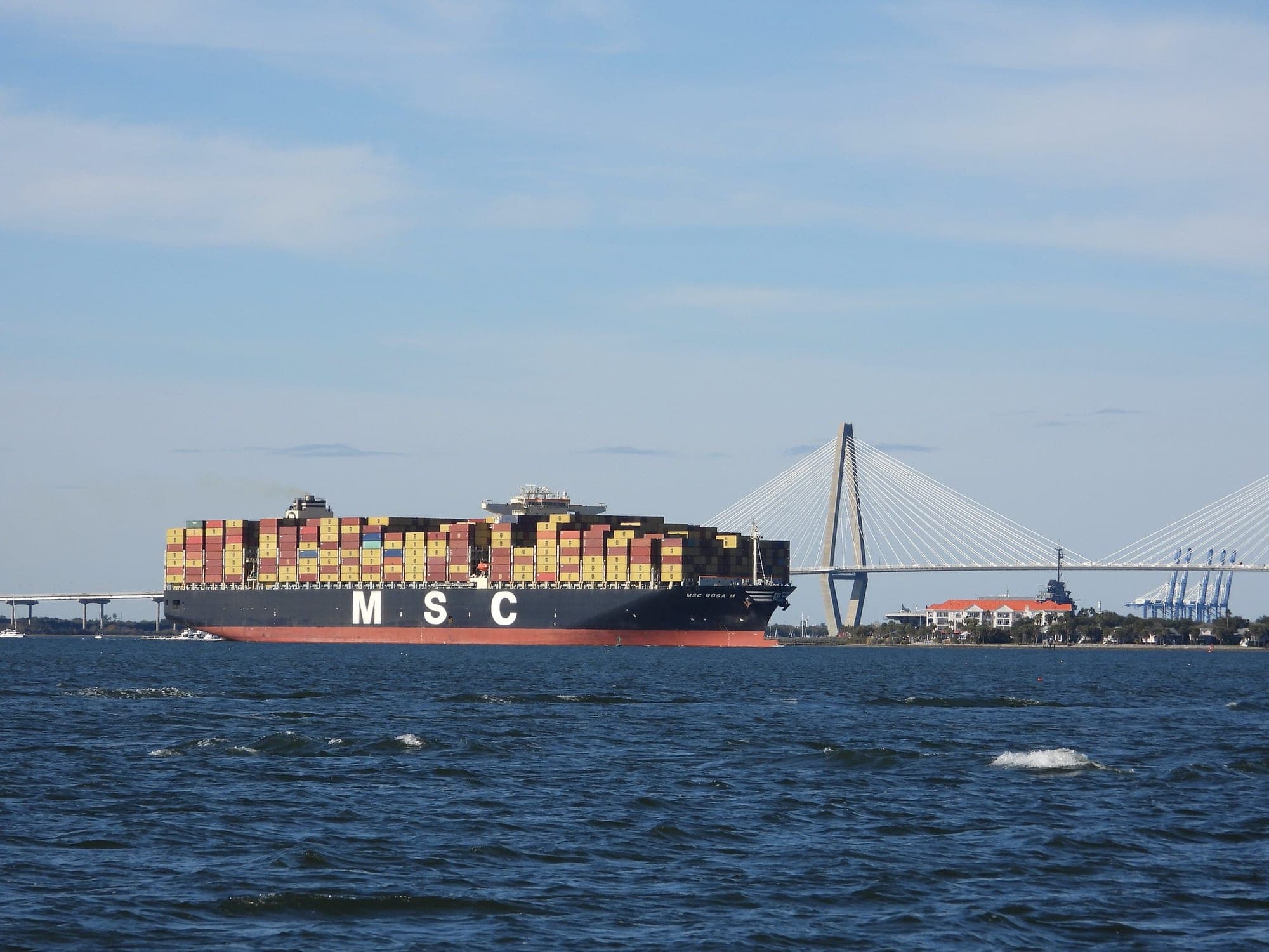 A Mediterranean Shipping Co. container ship moves through Charleston Harbor near the Arthur Ravenel Jr. Bridge in November 2025.